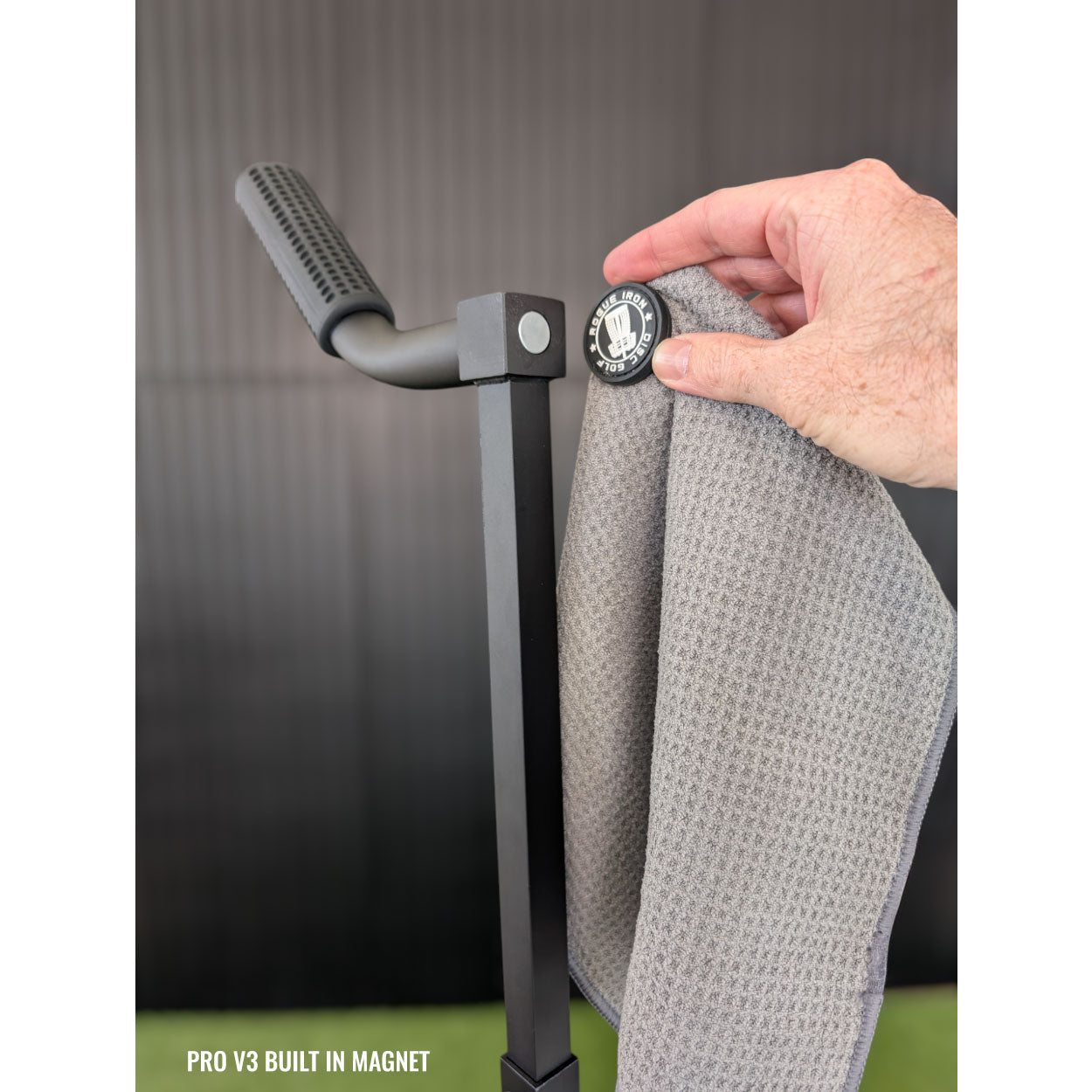Rogue Iron magnetic disc golf towel in use